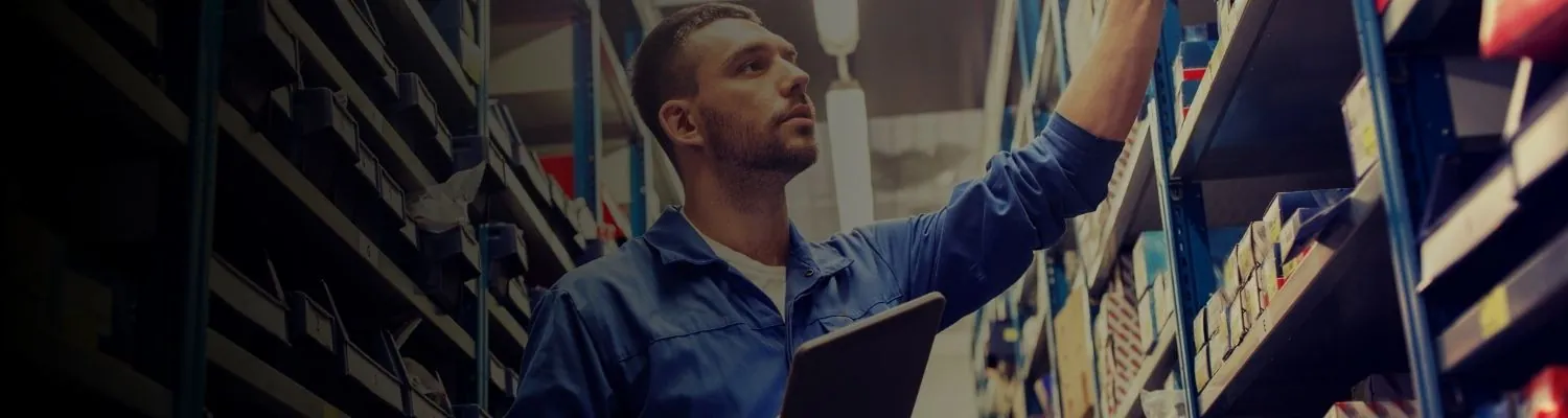 Streamline-It maintenance technician servicing warehouse automation equipment with genuine replacement parts
