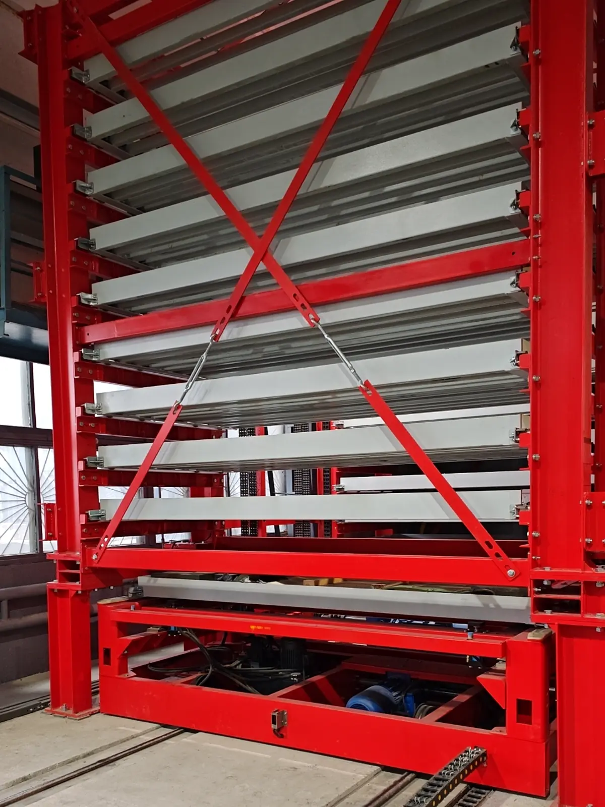 Vertical lift module for long parts with stacked cantilever trays holding bars, profiles, plates, and metal sheets